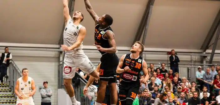 group of people playing basketball